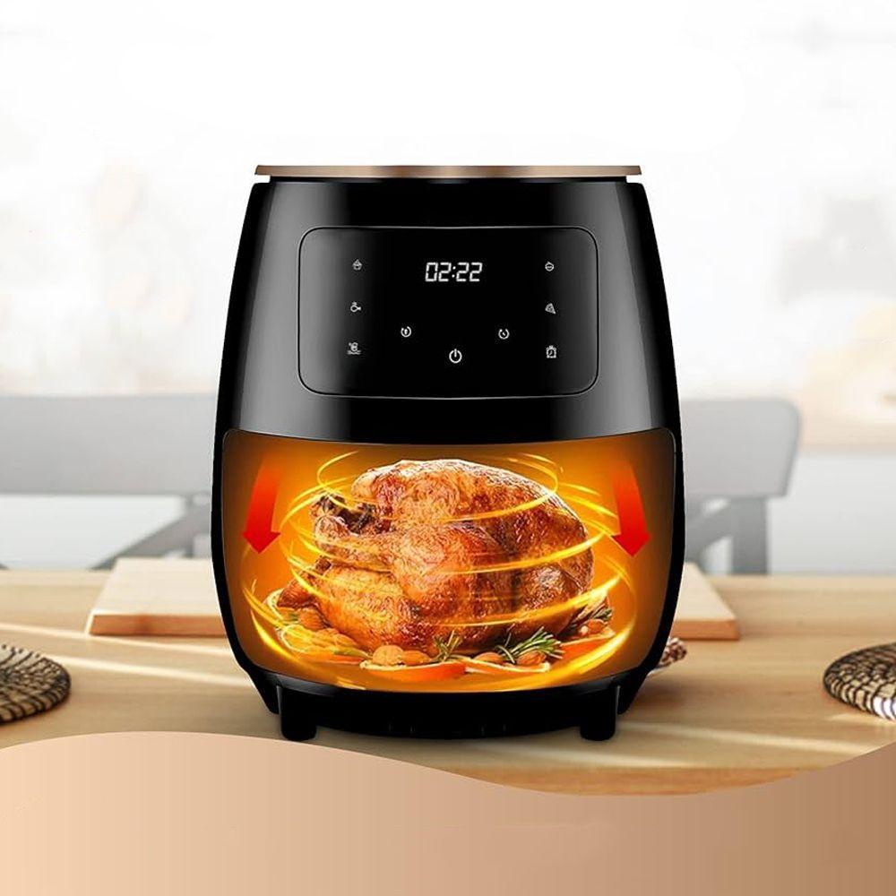 Friggitrice ad aria nera e beige con display digitale acceso, basket illuminato con pollo arrosto